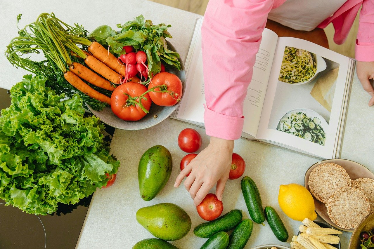well-balanced healthy meal plan with nutritious foods, including vegetables, lean proteins, whole grains, and fruits, arranged on a table for meal preparation